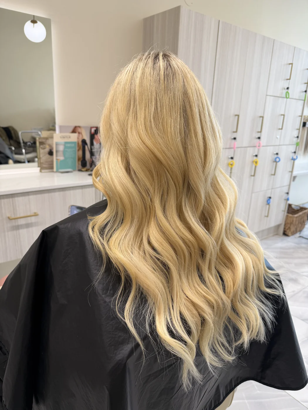 Bright blonde colour with soft waves, finished at Salon Dain Forest Hill