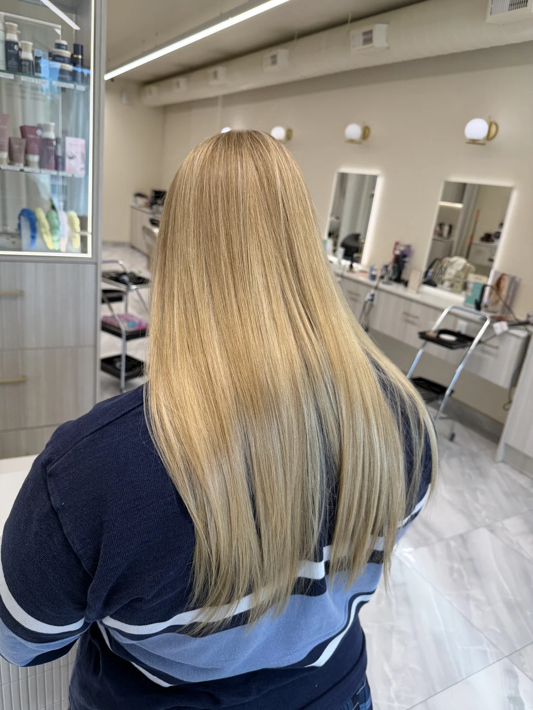 Blonde highlights finished sleek and glossy at Salon Dain Toronto