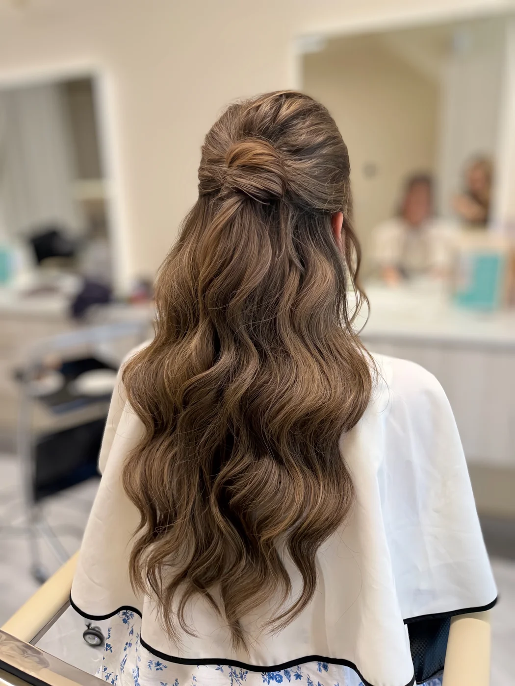 Bridal half-up updo with long soft waves at Salon Dain, Forest Hill Toronto